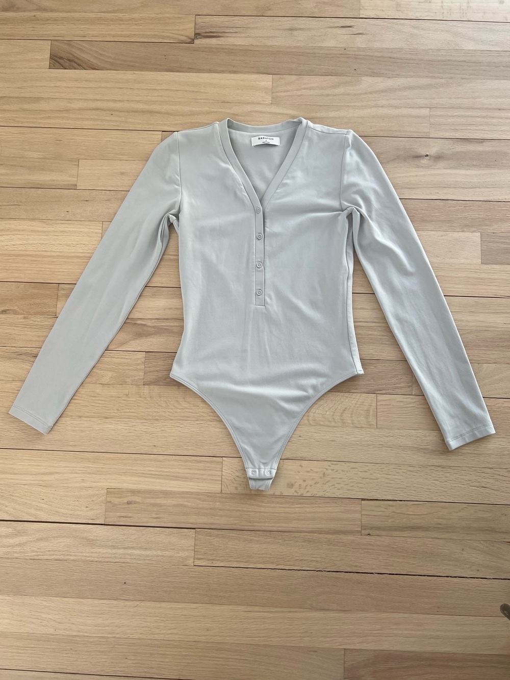 EUC Aritzia Long-Sleeved button-detail light gray- silvery Bodysuit